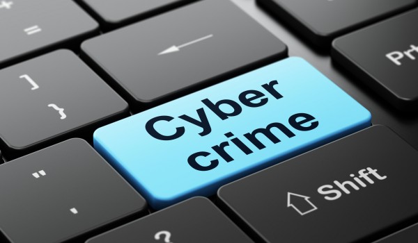 Security concept: computer keyboard with word Cyber Crime, selected focus on enter button background
